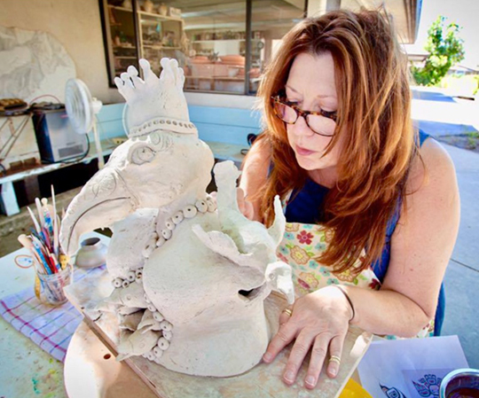 Maryann Cord working outside Beatrice Wood's Studio